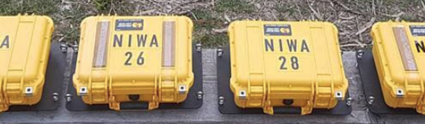 Six yellow WII buoy cases labelled and lined up before going into the ice on a NIWA deployment