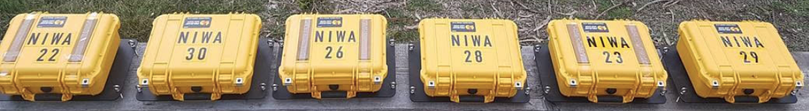 Six buoys labelled and lined up before going into the ice on a NIWA deployment.